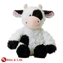 white and black cow plush toy